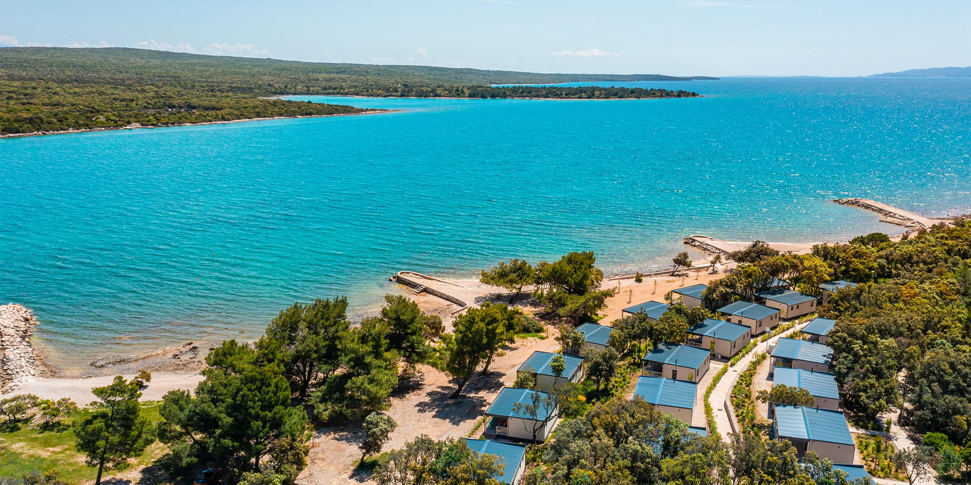 Mobilní domky v kempovém resortu na Jadranu: ostrov Lošinj s delfíny a nádhernými plážemi