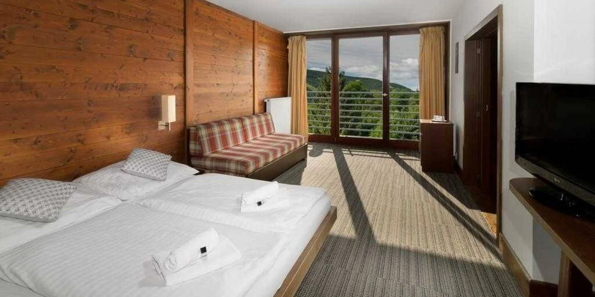 Wellness ve Špindlu se snídaní či polopenzí, neomezený vstup do bazénu a saunového světa