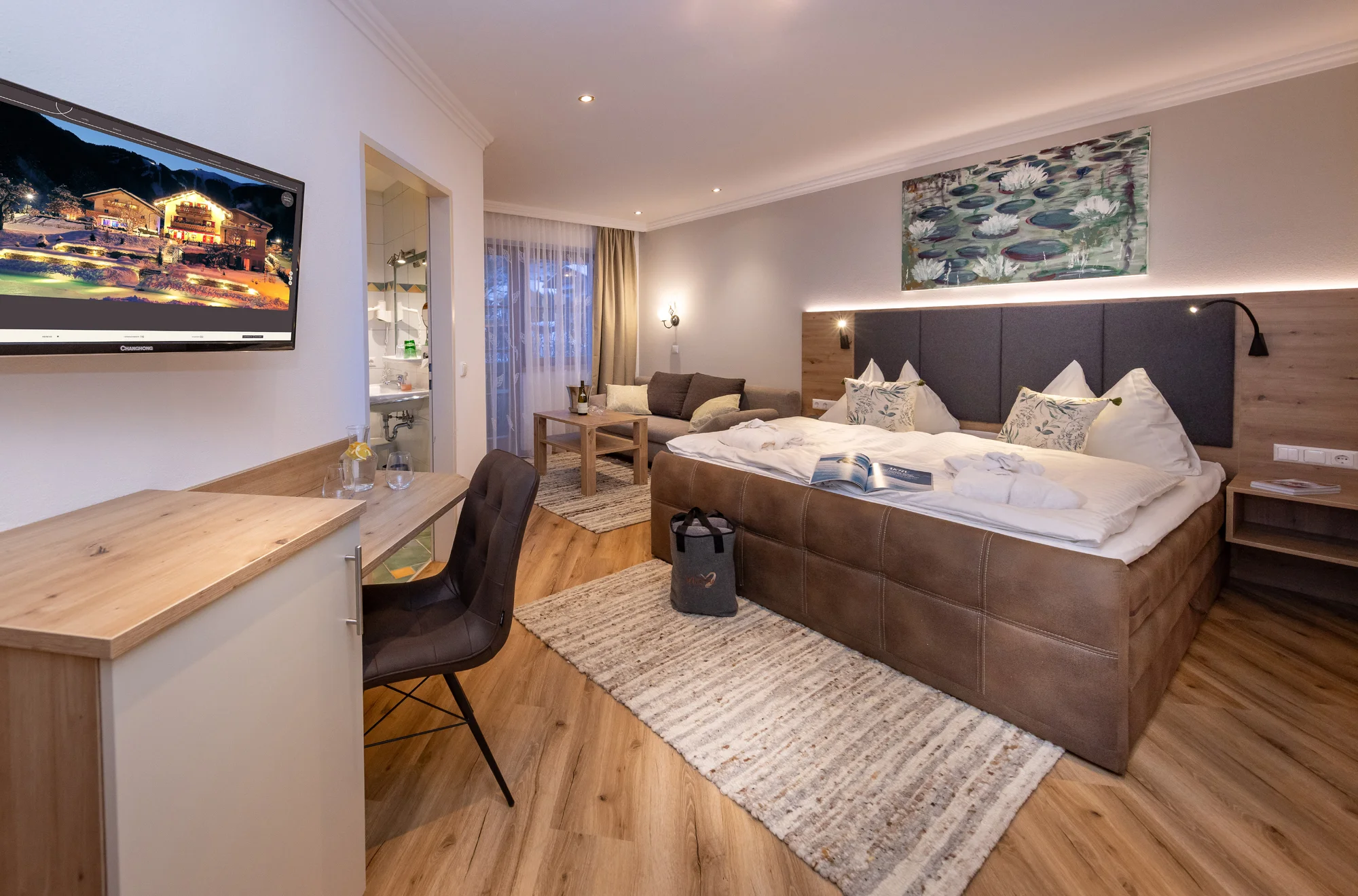Boutique hotel v Zell am See: wellness s přírodním jezírkem, polopenze i karta výhod