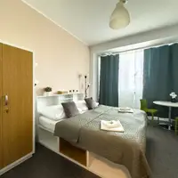Dvoulůžkový pokoj Comfort s manželskou postelí a TV