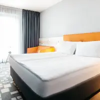 Dvoulůžkový pokoj s manželskou postelí (20–22 m²)