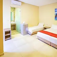 Třílůžkový pokoj, Annex