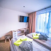 Dvoulůžkový pokoj část B** (18–22 m²)