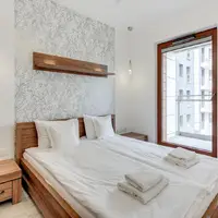 Pokoj se 2 ložnicemi a balkonem (55–60 m²)