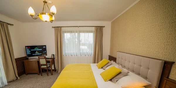 Dvoulůžkový pokoj LUX se dvěma přistýlkami (28–36 m²)