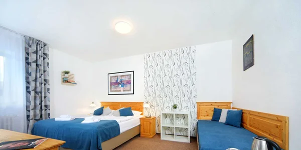 Dvoulůžkový pokoj s přistýlkou STANDARD+ (32 m²)