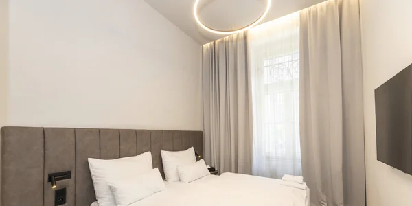 Dvojlôžková izba na zníženom prízemí (18 m²)