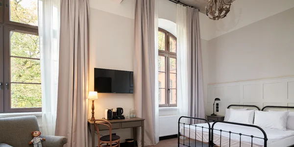 Rodinný pokoj (s manželskou postelí a rozkládací pohovkou) (27–32 m²)