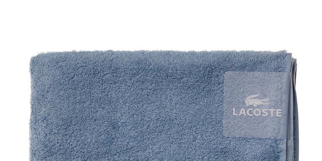 Větší blankytně modrý ručník Lacoste