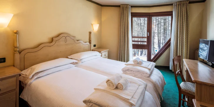 Zimní dovolená v Itálii: hotel přímo na svahu ve skiareálu Pila, polopenze a wellness