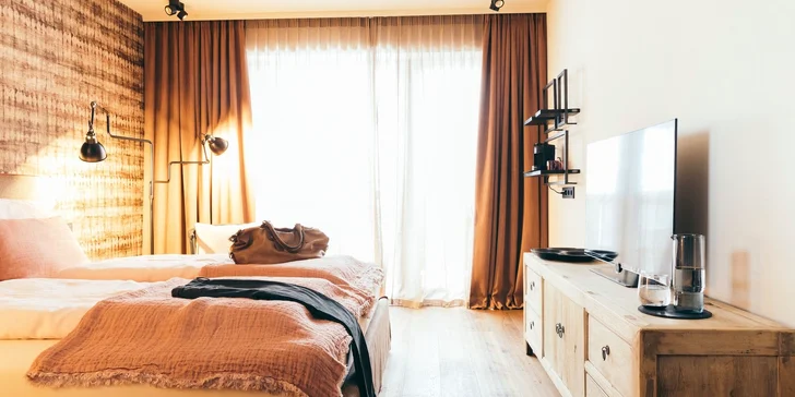 Hotel v rakouských Alpách přímo u sjezdovky: snídaně či gurmánská polopenze, wellness i karta výhod