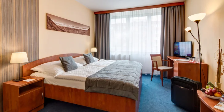 Dvoulůžkový pokoj Comfort s vlastní koupelnou, televizí a Wi-Fi připojením.