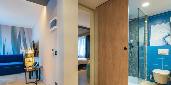 Srdcom apartmánu je potom obývacia izba s rozkladacou pohovkou a plne vybavenou kuchynkou.