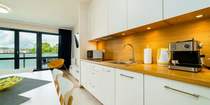 Všechny apartmány mají plně vybavený kuchyňský kout.