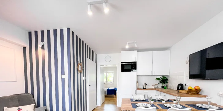 Apartmán nabízí kuchyňský kout s lednicí, mrazákem, myčkou i kávovarem.