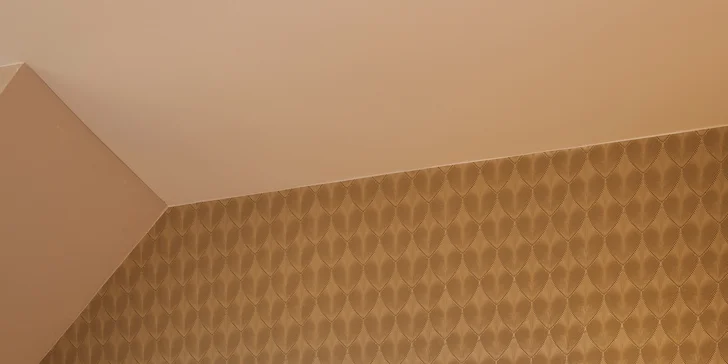 Ložnice v apartmánu DeLuxe.