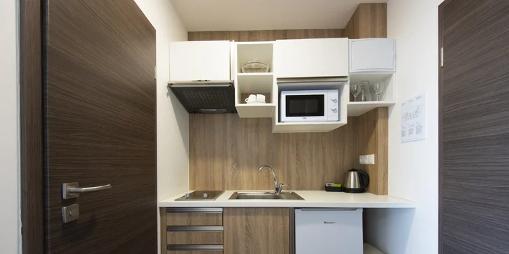 Ve stylových apartmánech nechybí ani kuchyňský kout.
