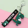 Klíčenka s dinosaurem - tmavě zelená
