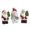 Vánoční postavičky: 2× Santa, 1× sněhulák
