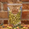 Mandle obalované v čokoládě s příchutí mango | Hmotnost: 100 g