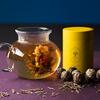 8 kuliček kvetoucího čaje, dóza a konvička