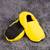 Nahřívací papuče, zářivě žluté a černé
