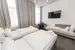 Trojlôžková izba v zníženom prízemí (22 m²)